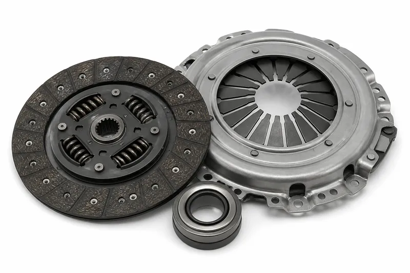 Clutch kit with friction disc, pressure plate and release bearing on a white background